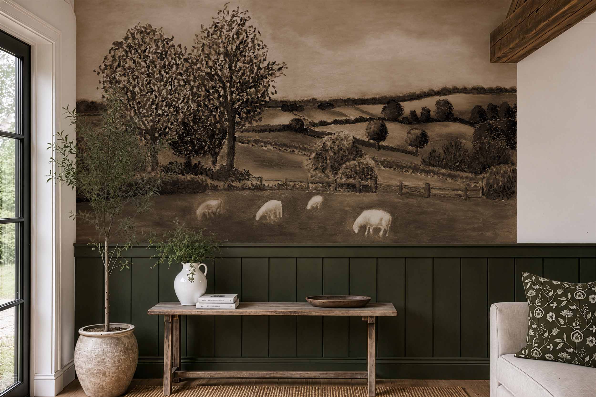 vintage-sepia-landscape-mural-wallpaper-entryway-paneling Vintage sepia landscape mural wallpaper above deep green paneling, with a rustic wood bench and an olive tree in a stone pot.